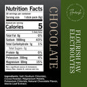 Front and back of a chocolate electrolyte stick pack package, showing a nutrition facts label on the left and product branding on the right. The package is dark brown/black on the left with a white nutrition panel and beige text, and dark green on the right with white text reading Flourish Electrolytes and CHOCOLATE.