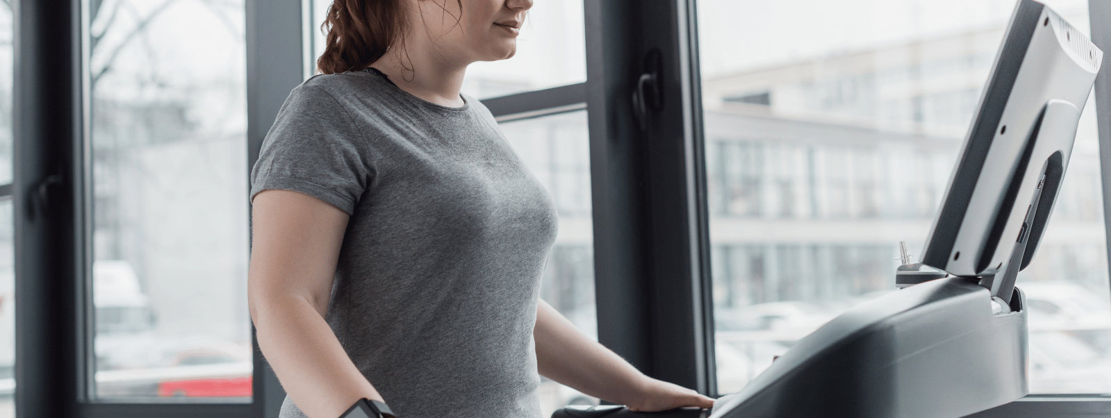 Person using a treadmill in a gym setting