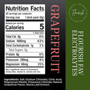 Front and back of a Grapefruit Flavored Electrolyte stick pack package design. The left side shows a white Nutrition Facts panel with text detailing calories, nutrients, and ingredients.