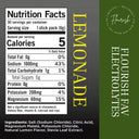 Front-facing product label for Lemonade electrolyte sticks by Flourish, showing a nutrition facts panel, vertical 'LEMONADE' text, ingredients list, and a dark green side panel with the brand name.