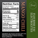 Front and back of a mango chili stick pack, showing the nutrition facts panel on the left and the back design on the right with a dark green background and white text.