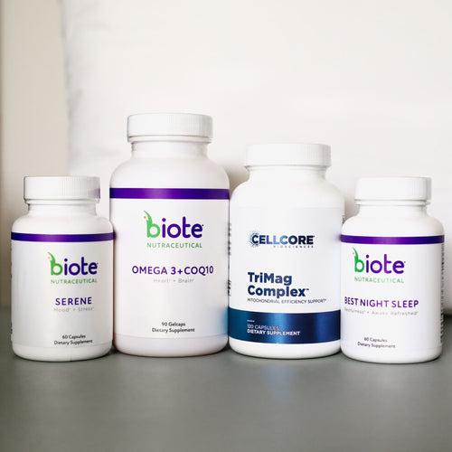 Four white supplement bottles from Biote Nutracetical arranged on a gray surface against a white background. The bottles are labeled Serene, Omega 3 + CQ10, TriMag Complex, and Best Night Sleep.