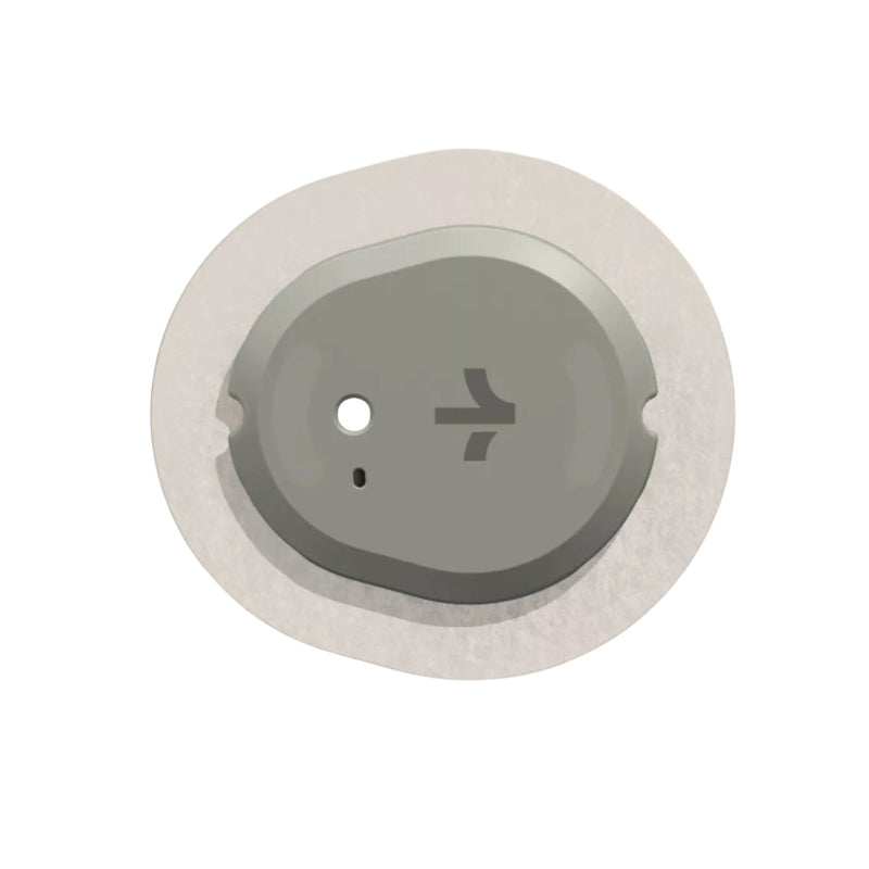 Round metallic object with a central hole and symbol on a white background