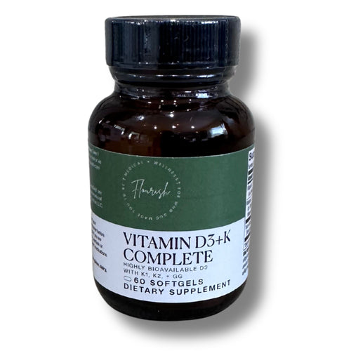 A dark amber glass bottle of Flavour of Wellington Vitamin D3+K Complete dietary supplement with a black cap and a green and white label, shown on a white background with a soft shadow.